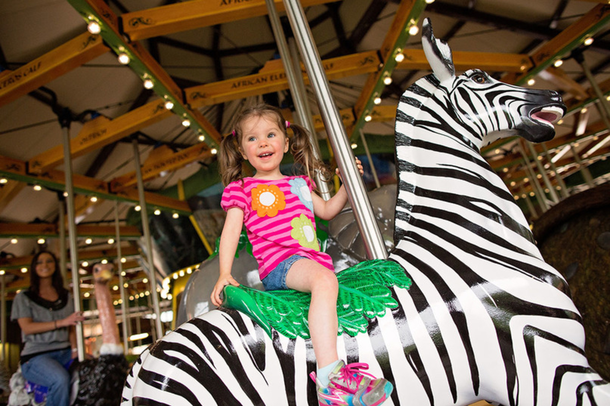 child on carousel